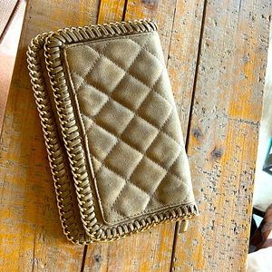 Nude and gold clutch